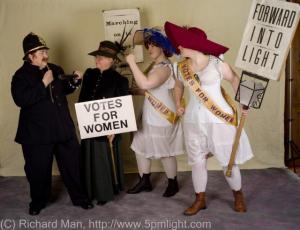 Steampunk Cosplayers re-enacting a tiff between authorities and suffragettes. 