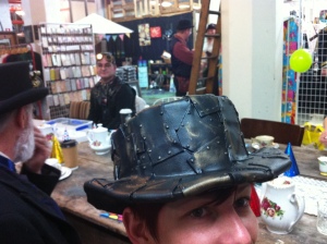 Mimicking a hat riveted together from metal plates.