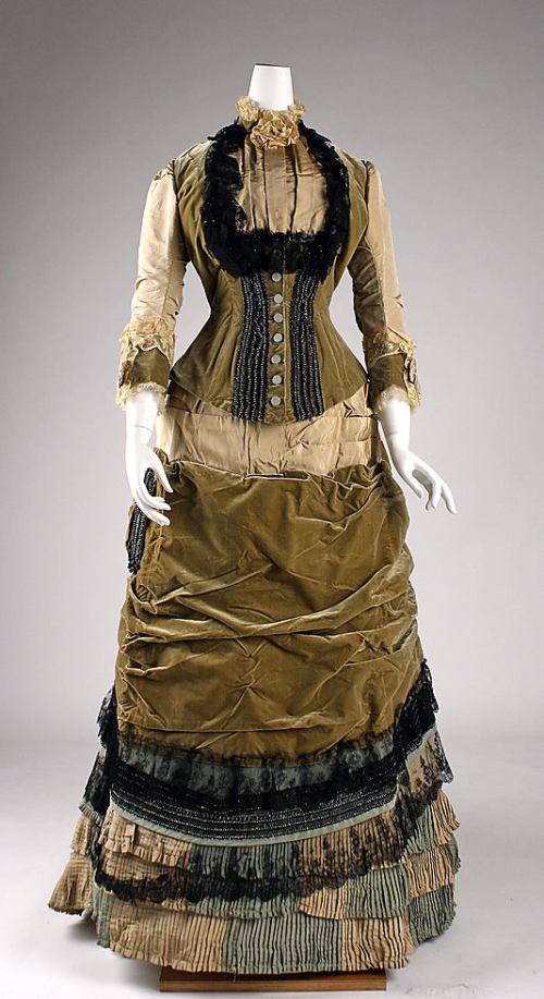 Front of over-trimmed dress from Pragmatic Costumer's website 1878, origially image from Metro Museum of Art