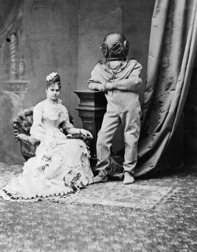 1880-miss-bernhardt-the-ocean-express-miss-bernhardt-with-person-in-deep-sea-diving-gear-standing-alongside